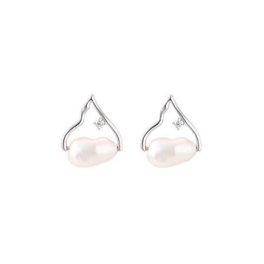 Silver mountain outline studs with baroque pearl and diamond accent on white background