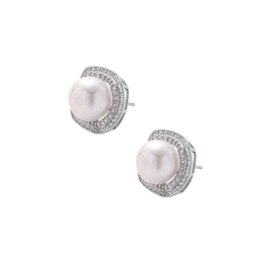 Rhodium-plated sterling silver stud earrings with round freshwater pearls surrounded by geometric crystal halos on cream background.