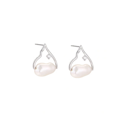 Silver mountain outline studs with baroque pearl and diamond accent on white background